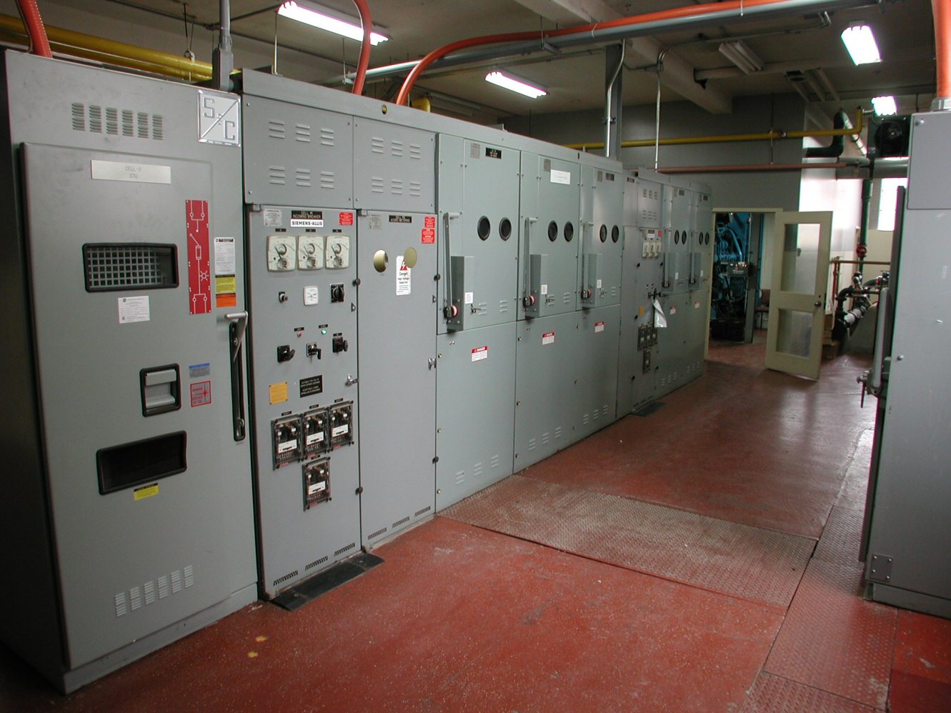 Electrical switchgear and distribution panels inside a building’s main electrical room