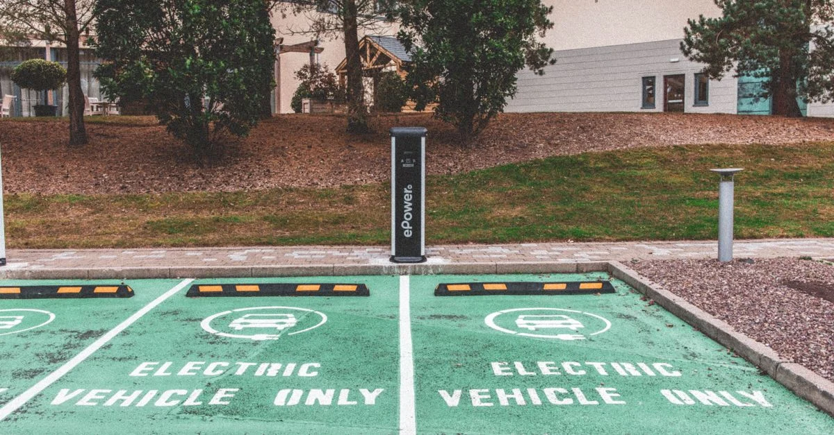 Electric-vehicle charging bays beside a commercial property